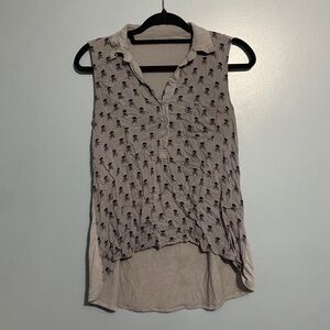 Grey sleeveless top with skull and crossbones